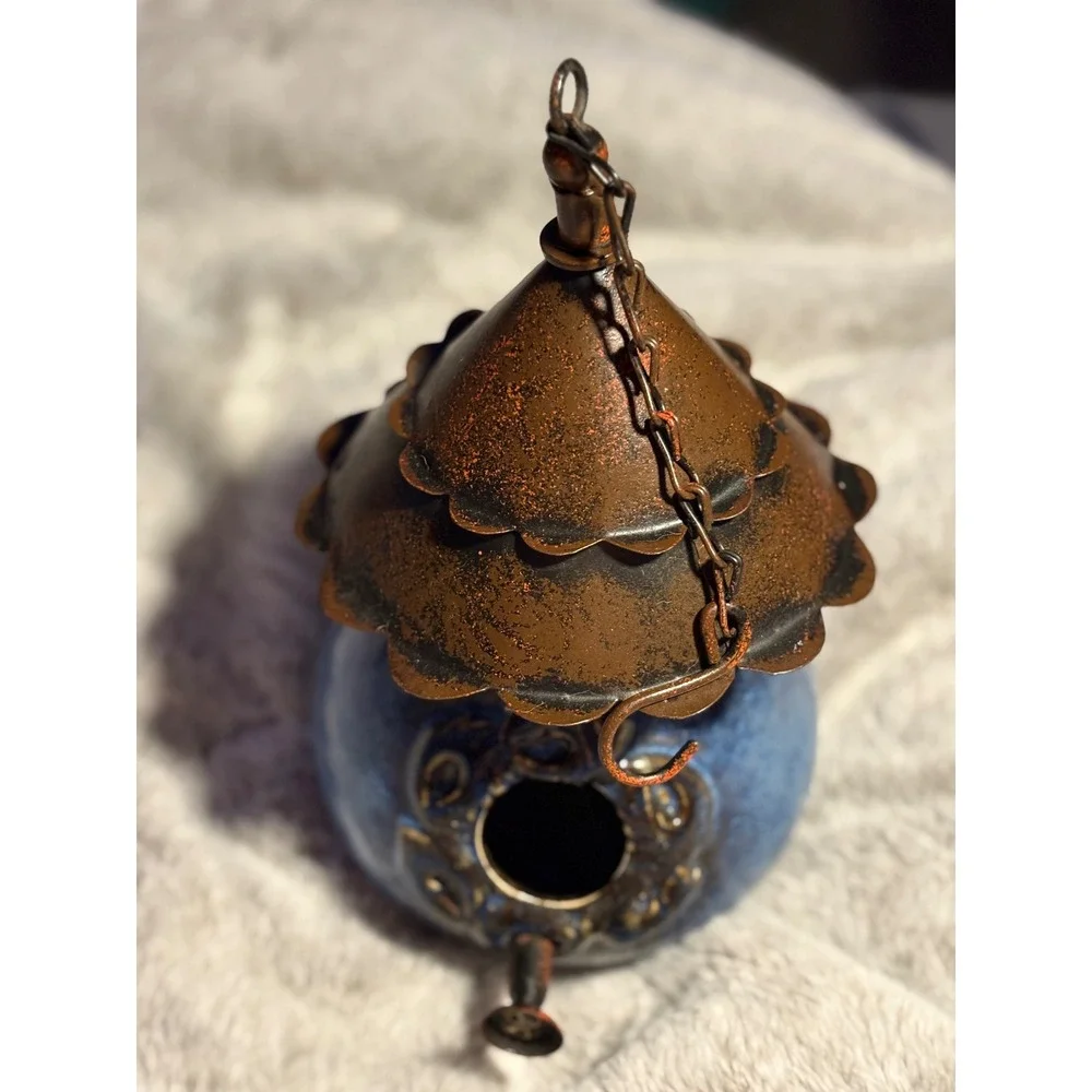 Handmade Blue ceramic birdhouse with a metal, antique copper-finish roof